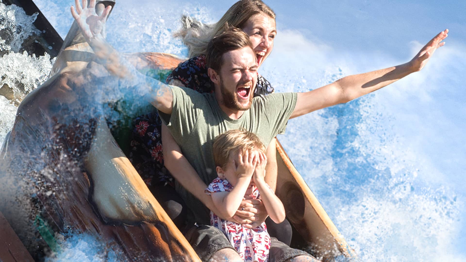 Young Family On Wooden Boat Slide