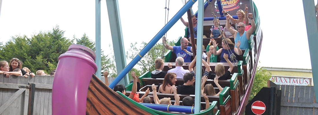 A Group Of Families On A Swing Ride(1)