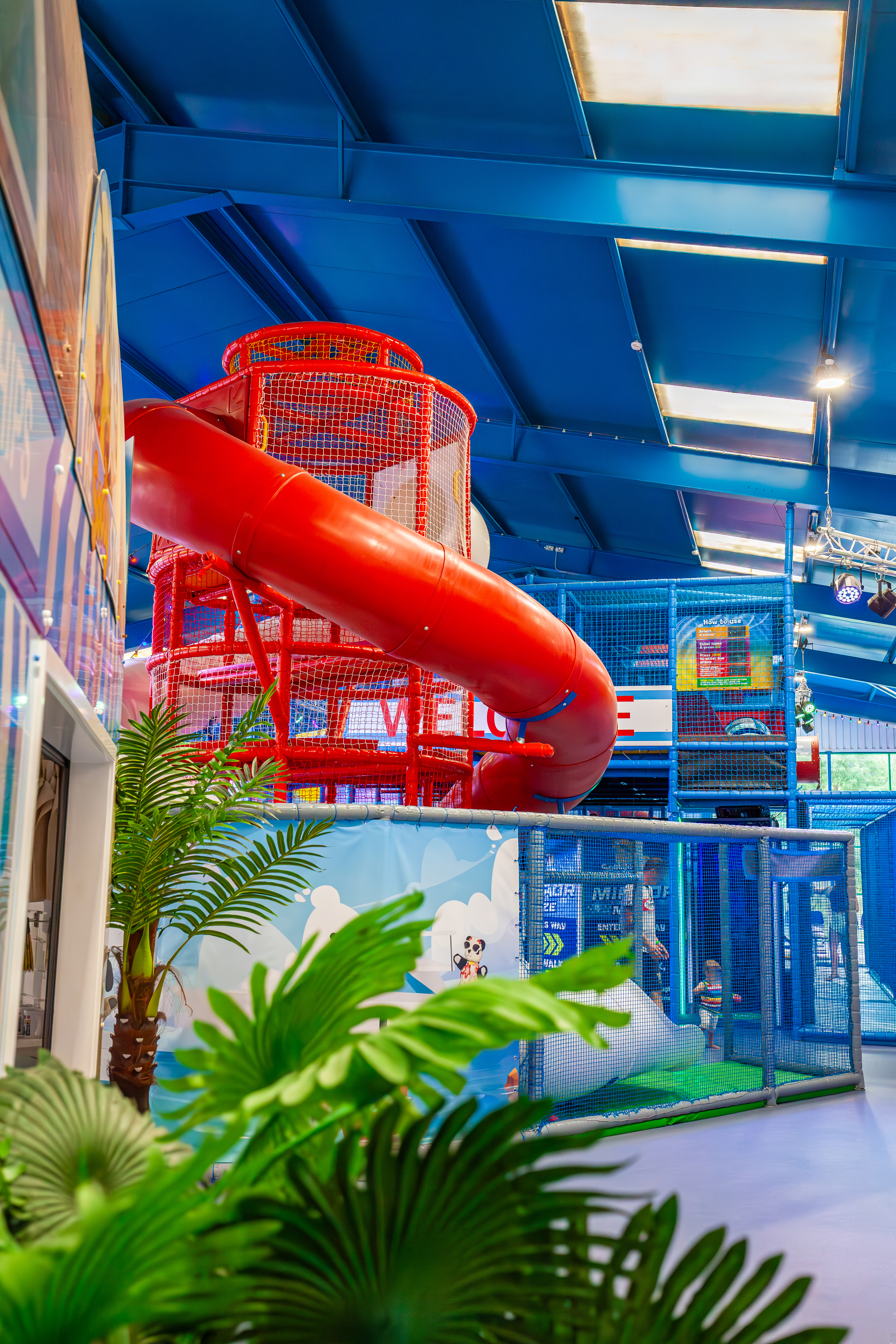 An image of a curly Helta Skelta slide in a giant indoor play zone 